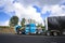 Truck drivers repairing big rig semi truck with open hood right