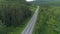 Truck drives along highway on background of forest in summer. Scene. Long-distance cargo transportation. Truck goes