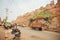 Truck driving on dirt road near historical Jaisalmer fort built in 1156 AD