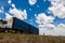 A truck driving on a flat road in the Free State, South Africa.