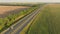 Truck driving highway sun sunset road transport forest field aerial