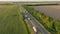 Truck driving highway sun sunset road transport forest field aerial