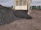 The truck dumping coal cargo at the stockpile