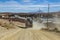 Truck on dusty track enter a village in Bolivia.