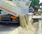 Truck in the excavation after laying of underground electric cab