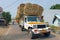 Truck full of hay bales in the streets of Tiruvanamalai India
