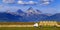 Truck Hauling Hay with Teton Mountains in Background Farming Operation