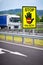 Truck on the highway in the austrian countryside with the STOP/ FALSCH stop / false sign to warn the drivers