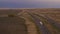 Truck on Highway and Stormy Sky. Montana, USA. Aerial View