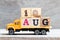 Truck hold block in word 10aug on wood background Concept for date 10 month August