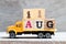 Truck hold block in word 11aug on wood background Concept for date 11 month August