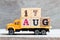 Truck hold block in word 17aug on wood background Concept for date 17 month August