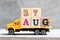 Truck hold block in word 27aug on wood background Concept for date 27 month August