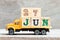 Truck hold block in word 27jun on wood background Concept for date 27 month June