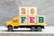 Truck hold block in word 29feb on wood background Concept for date 29 month February , leap day