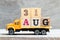 Truck hold block in word 31aug on wood background Concept for date 31 month August