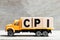 Truck hold block in word CPI abbreviation of Consumer Price Index on wood background