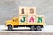Truck hold letter block in word 13jan on wood background Concept for date 13 month January