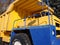 Truck. Industrial mining equipment. Against the backdrop of beautiful green firs and blue sky