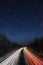Truck light trails on highway. Art image . Long exposure photo taken on a highway