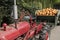 A truck load of pumpkins pulled by a tractor