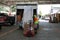 A truck load workers fill a truck with construction material