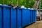 Truck loading a full recycling container trash dumpsters being full with garbage container trash