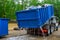 Truck loading a full recycling used construction material in the new building work site