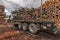 Truck loading wood in an outdoor pine wood warehouse