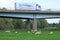 Truck passing bridge over farmland