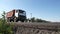 Truck passing roadside camera in the countryside, view from ground