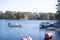 Truck pulling boat and trailer out of the water at the shore of a lake