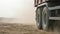 Truck rides on sand quarry road. Scene. Top view of dump truck driving on yellow dirt road in countryside. Large trucks