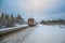 The truck rides on a snow-covered Arctic road