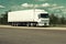 Truck on road, blue sky, cargo transportation concept, yellow toned