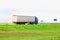 A truck with a semi-trailer transports cargo in summer in cloudy rainy weather on a wet road in the rain. Skidding on