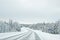 Truck in a snow covered road to Kuolio in Finland on the Arctic