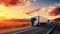 A truck speeds in front of wind turbines on a highway at sunset