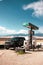 Truck stopped at a gas station in a deserted area with dunes,  National Park in Colorado, vertical