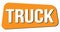 TRUCK text on orange trapeze stamp sign