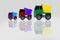 Truck toy mini, truck scale model made of plastic with multicolor isolated on grey background.