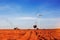 Truck tractors are plowing tillage with the blue sky.