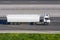 Truck with trailer tank rushes along the highway road.