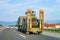 Truck trailer transporter and hauler carrying tractor on road Slovenia