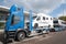 Truck transporter carrying RVs