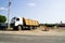 Truck transporting sand on a construction site