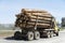 The truck transports the cut trees. Timber transports lumber. Ve