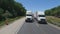 Truck traveling on a busy asphalt highway near Channahon IL recorded on a backup camera