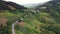 A truck traveling on the curvy road in the mountains in countryside.