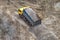 Truck unloading rock rubble gravel to the ground view from above summer